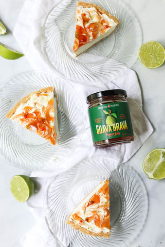 Summer product photography of a frozen margarita and guava pie with cut limes.