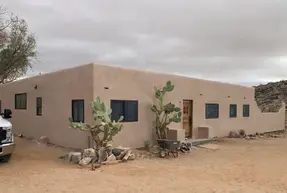 Stucco finish on adobe-style home in the desert.