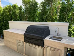 Stucco finish on outdoor kitchen and grill area.