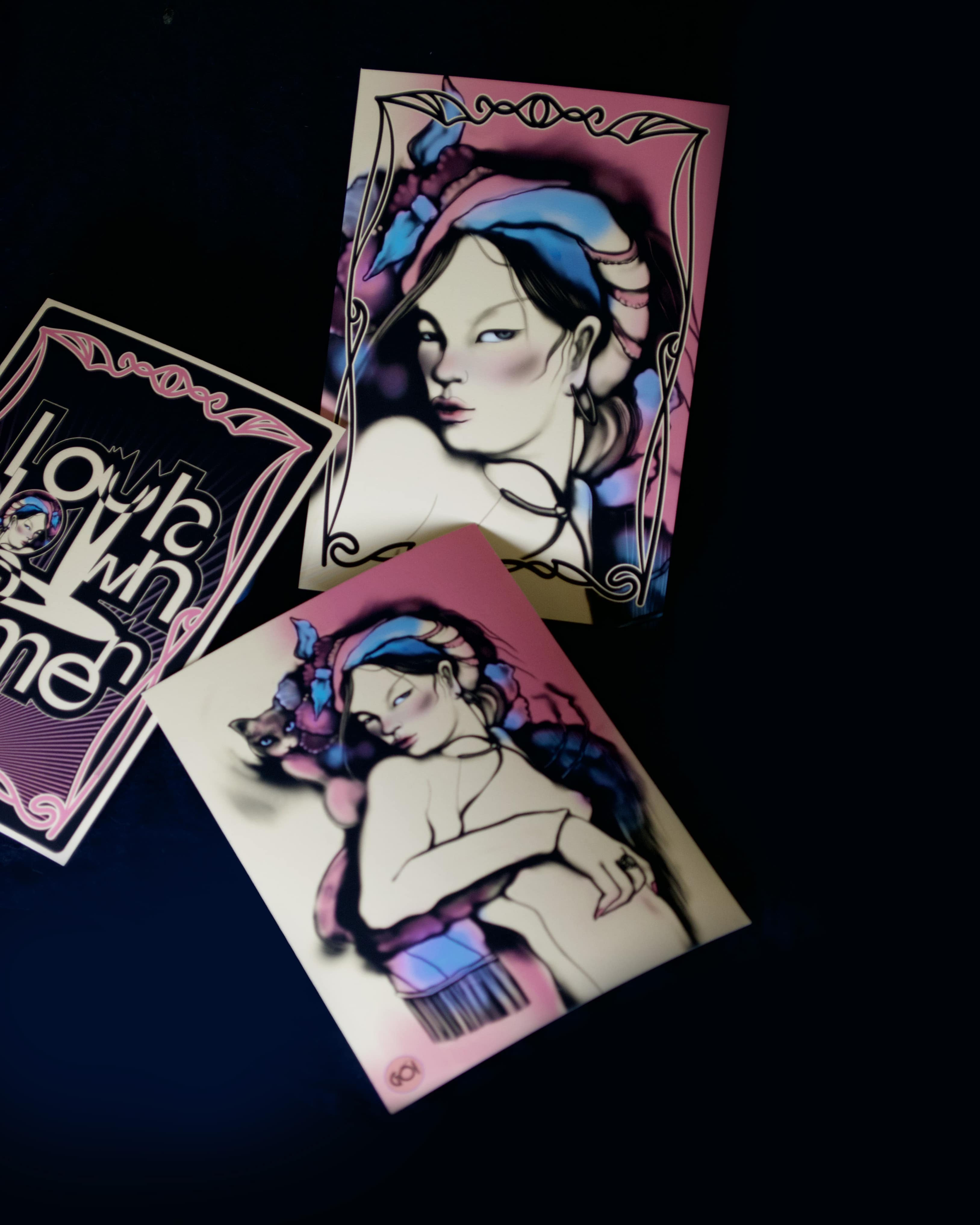 Set of 3 muted black and beige mini art collectible postcards featuring haughty female portraits and bold typography.