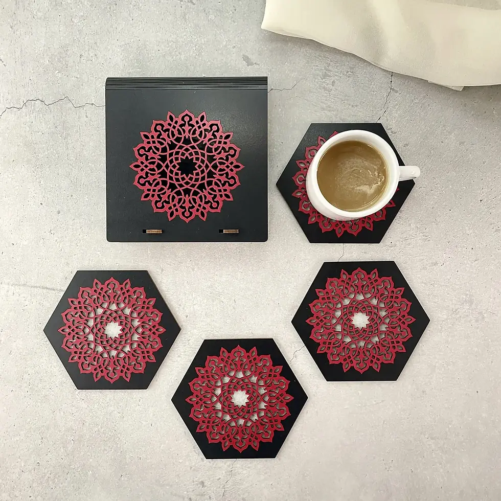Aurelia laser cut coaster set with designer box in black and red with tea cup, flat lay lifestyle image