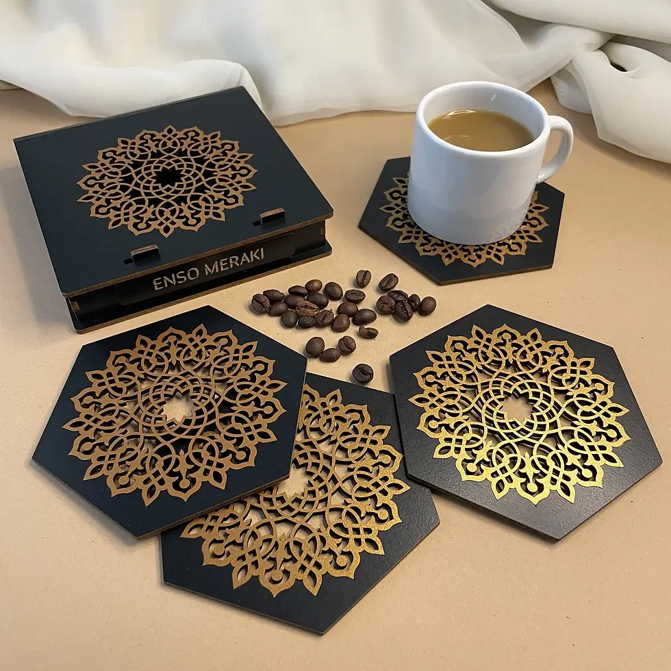 Aurelia Hexagon coaster set in Black and Gold at an angle lifestyle shot with ceramic mug