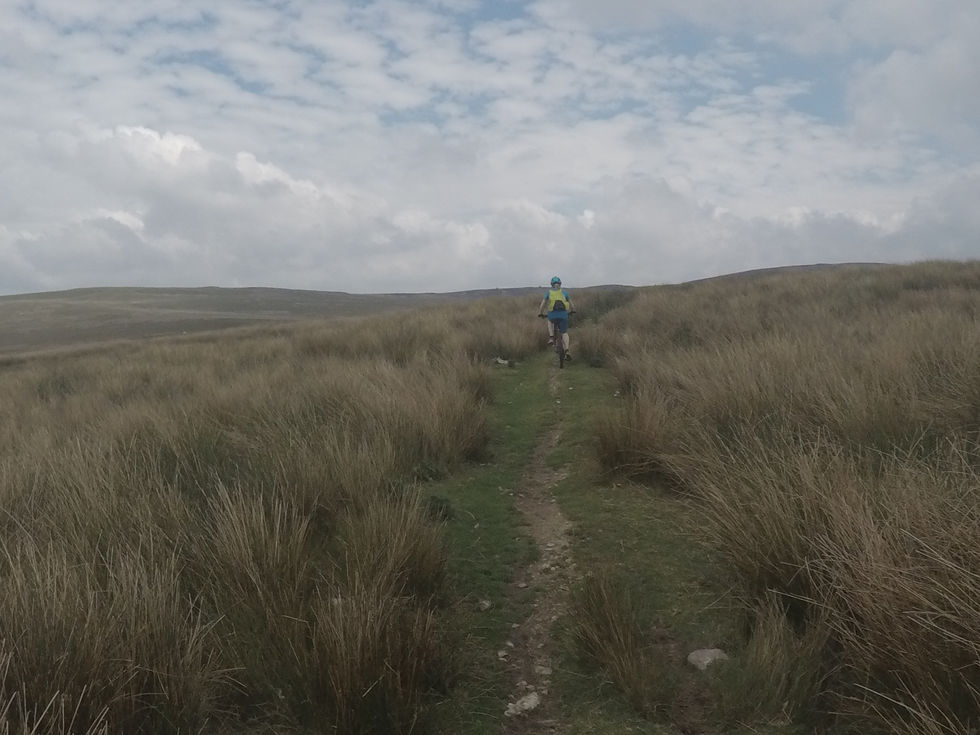mountain biking across the moorland to the Alwen Reservoir