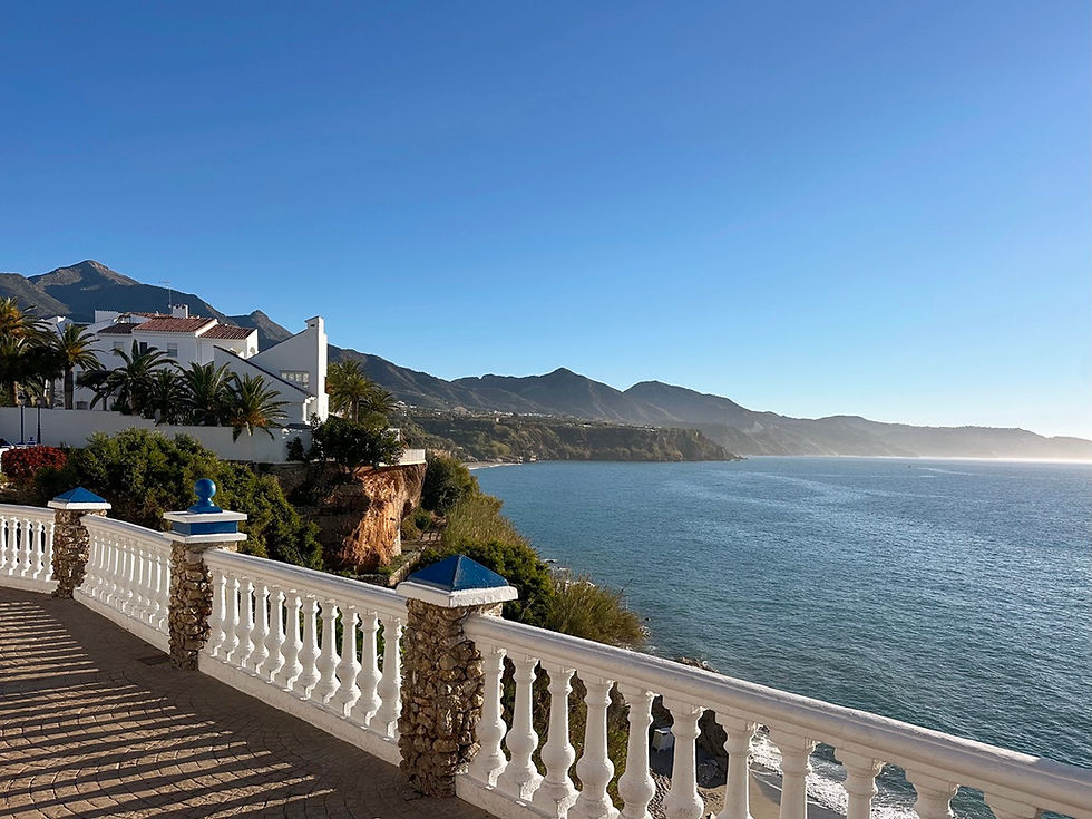 View from Mirador del Bendito in Nerja with Playa Burriana visible in the distance on a clear day