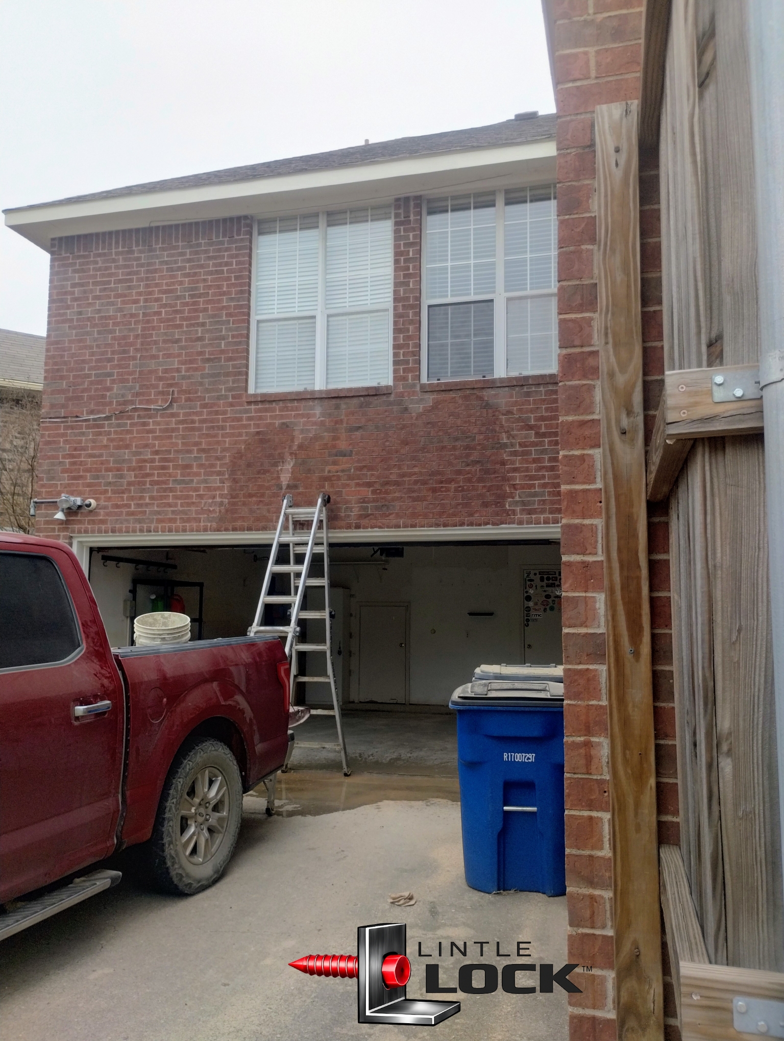 Garage lintel showing sagging brick above the garage door (Dallas project photo)