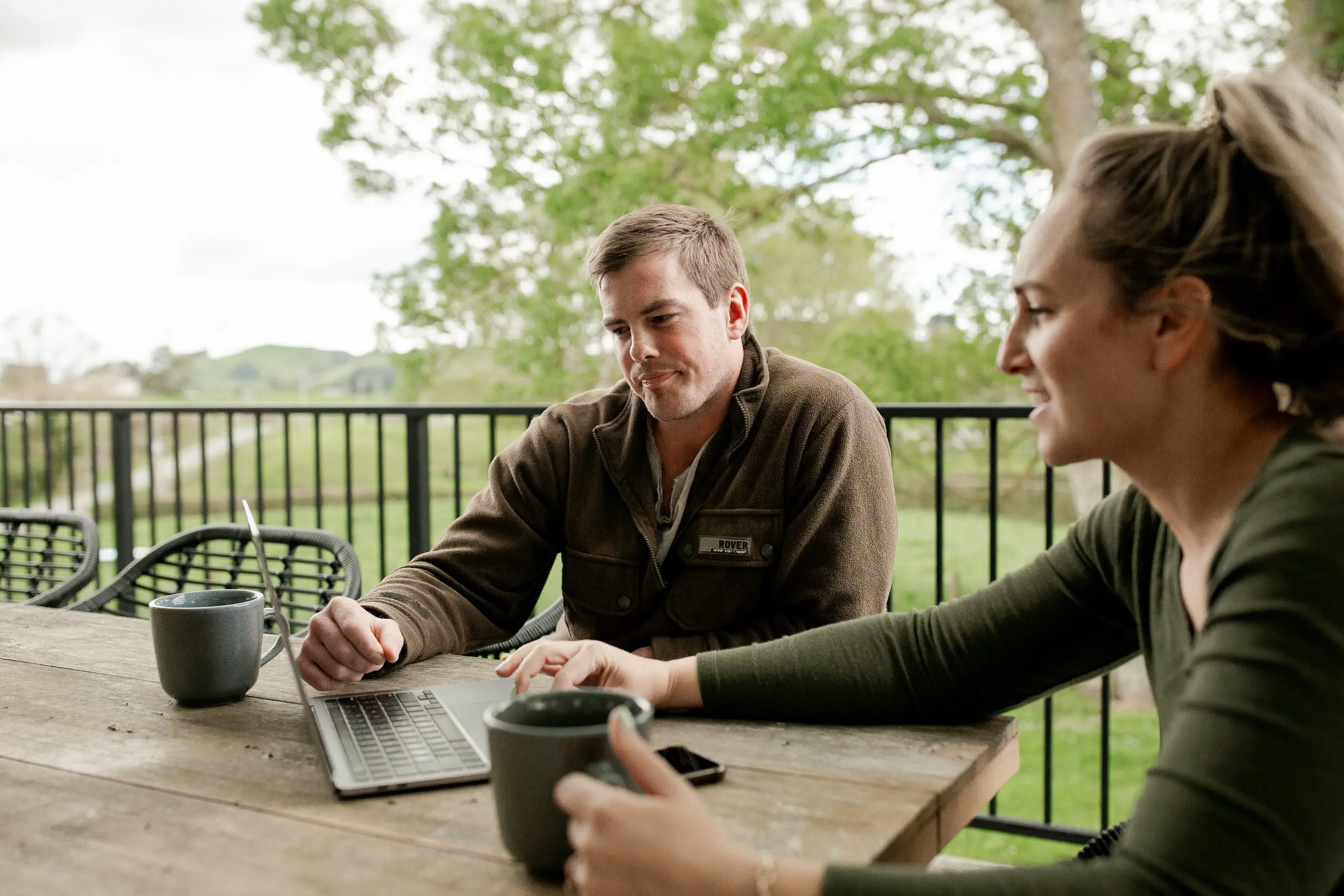 young farmer siting down with wife discusing Tabula Online