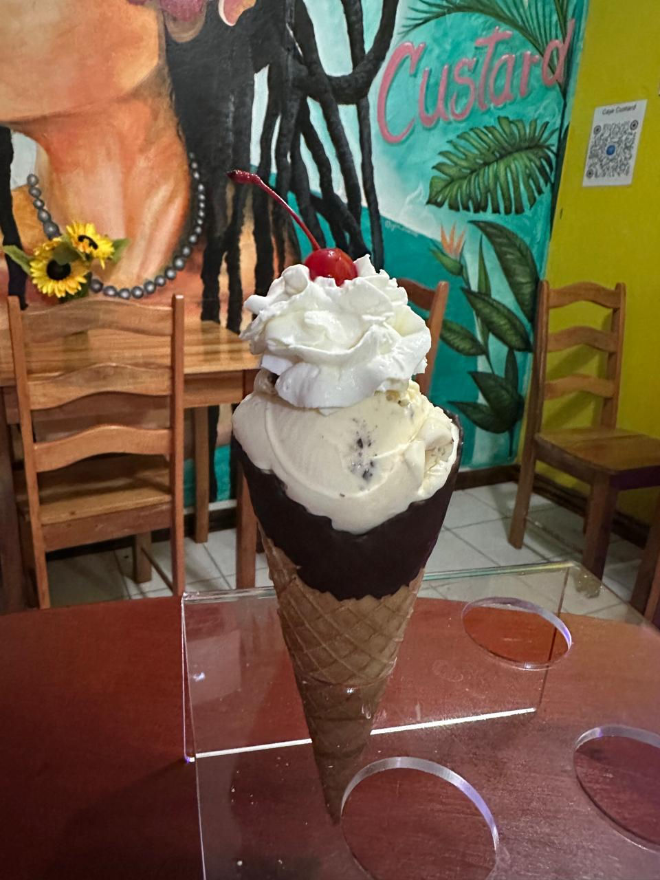 Cookie Dough Custard w/ whipped cream in a chocolate dipped waffle cone