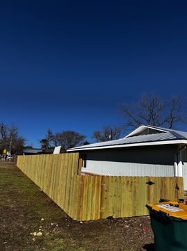 Privacy fence installation in Boerne, Texas with new wood fence panels around residential property