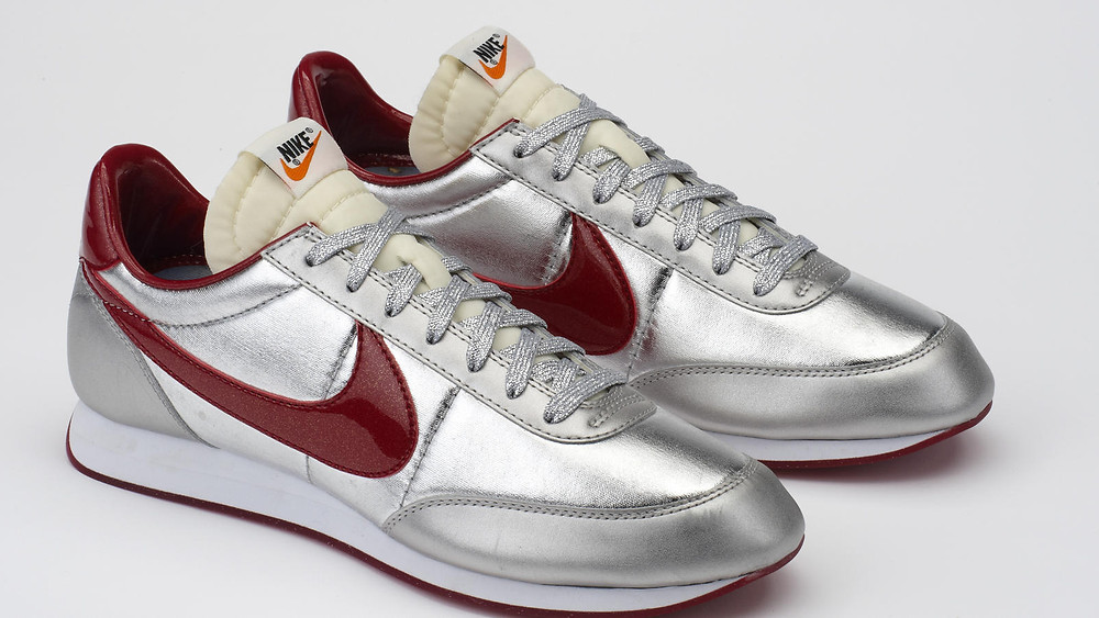 The silver disco shoes with a smooth rubber bottom with sparkles- Pure Performance