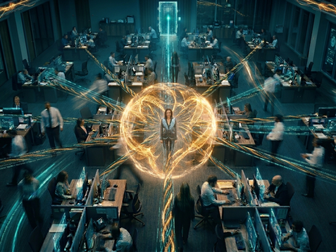 A cinematic overhead photograph of a large corporate operations centre. A lone figure in a grey suit stands perfectly still at the centre of the frame, surrounded by a glowing orb of interlocking golden light filaments that radiate outward in multiple directions across the office floor. Other workers are captured in motion blur around the edges, suggesting constant movement and activity. The room is lit in deep teal and blue tones with glowing screens on the walls and desks. A beam of cyan light rises vertically from the central figure toward a luminous portal in the background. The overall effect is of one person as the calm, connected source of energy in a complex, fast-moving organisation.