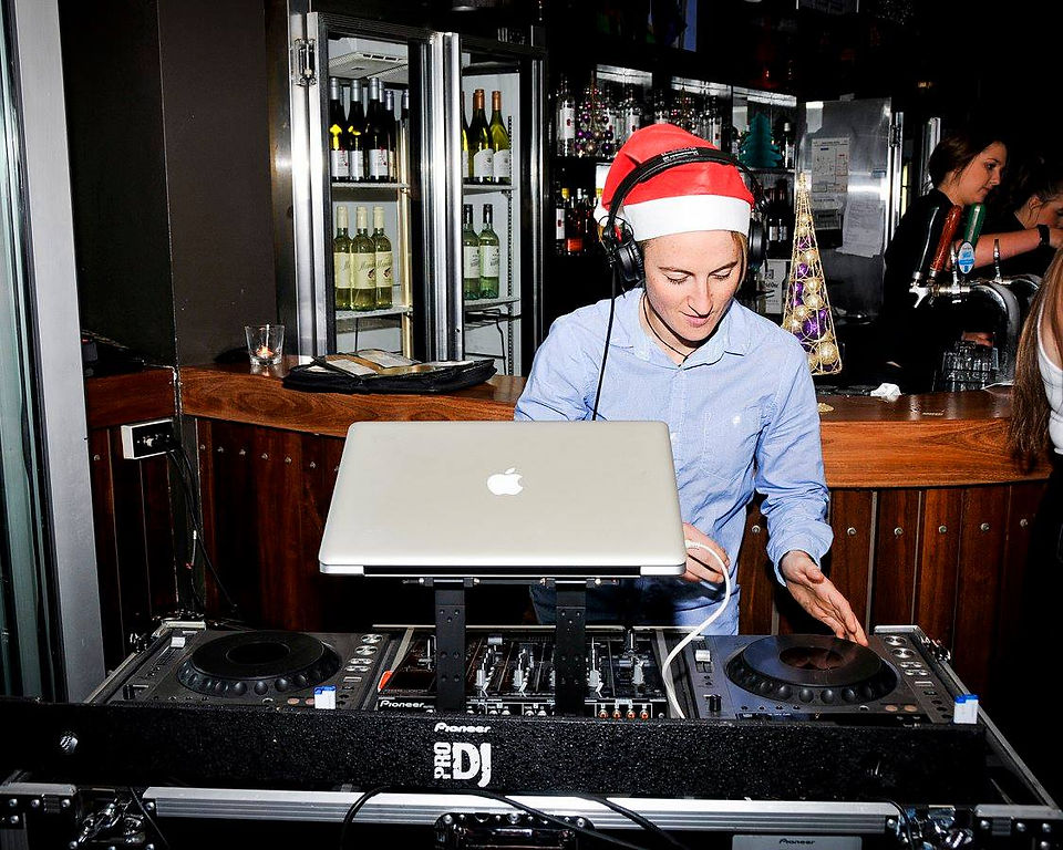 DJ Behind the decks at a christmas party