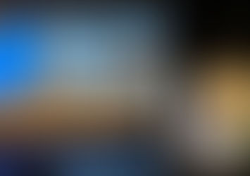 Three people at a podium in front of the Sundial Film Festival Cinema Screen