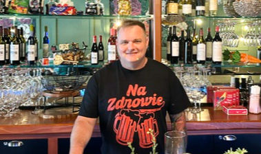 Co-owner, Jay Fischer, stands beside Krystyna’s 20” wide (amazing!) bar, which features beer, wine, and cocktails from Poland and the United States.