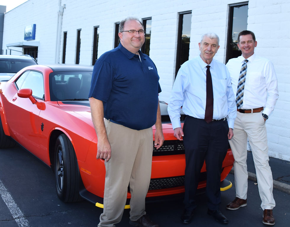 Steve Roberts, center, Owner and General Manager of Crown Motors, with Ford/Lincoln Sales Manager, John Taylor, left, and Finance Manager, Jason Luther.