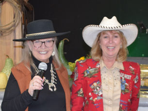 2 Women Hosts with cowboy hats of the Tehama County Cattlewomen - "100 Years of Cowgirls Luncheon & Fashion Show" speaking