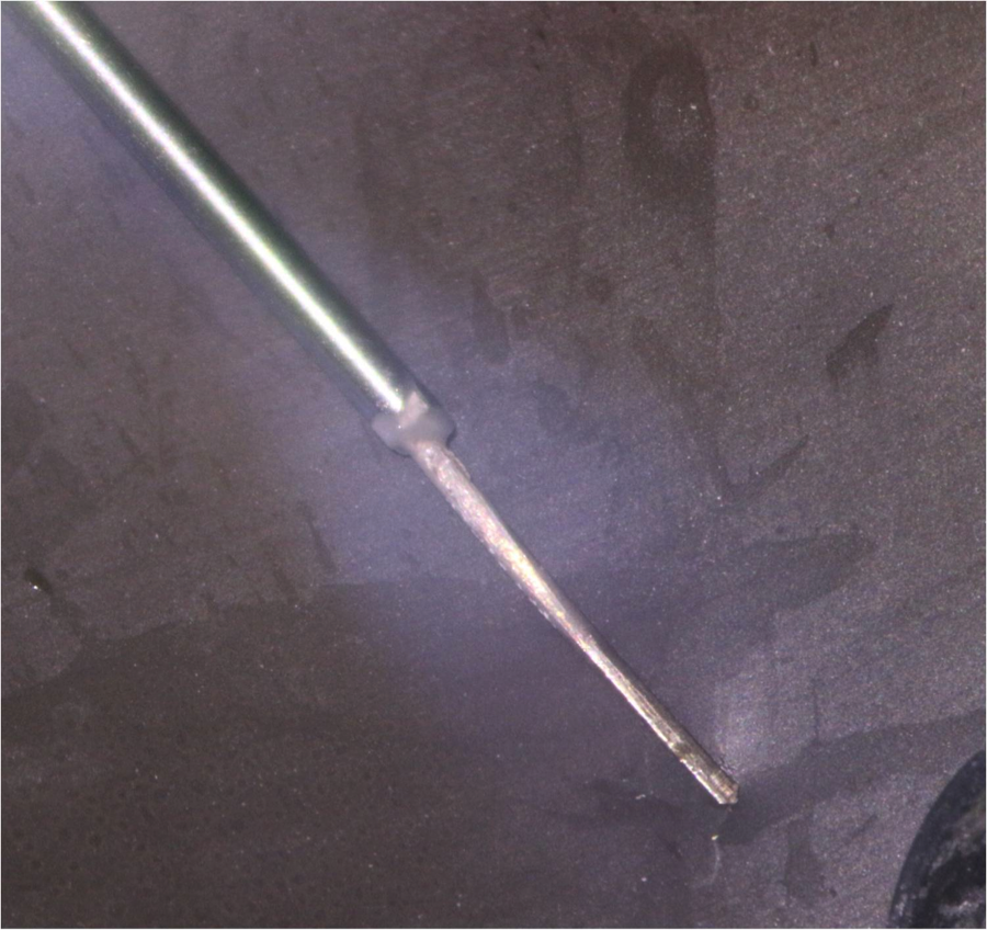 Figures 8, 9 showing the silver point bonded within the composite applicator tip