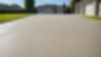 Eye-level view of a concrete driveway showing its smooth surface and robust structure