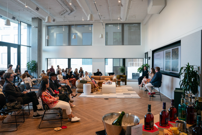 Guests engaged in conversation at a San Francisco fireside chat event