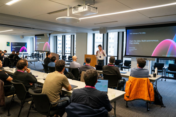 AWS Startups conference presentation with attendees seated in a Silicon Valley event space, photographed by Nico Hend Photography.