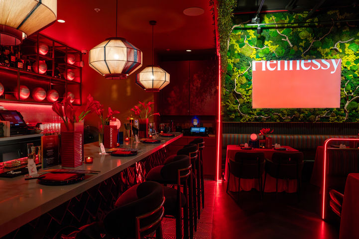 Hennessy screen, bar and red event décor at Kaiyo Rooftop in San Francisco