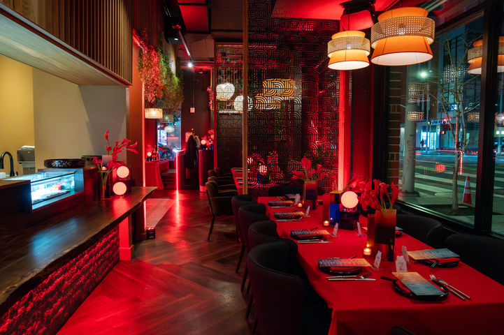 Hennessy branded dining area with red event décor and lighting at Kaiyo Rooftop