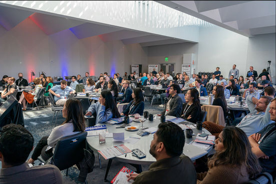 Wide-angle editorial shot capturing the atmosphere of a conference at the W Hotel in San Francisco