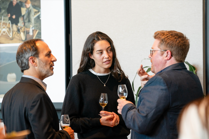 Guests engaged in conversation at a San Francisco fireside chat event