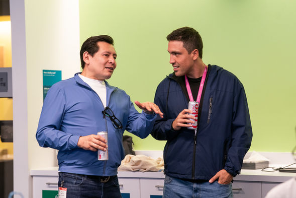 Two attendees talking during a break