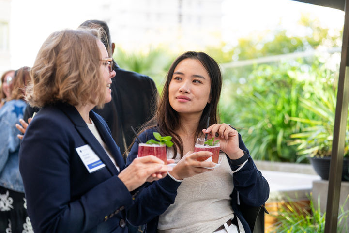 Two guests enjoying colorful cocktails at The Jay.