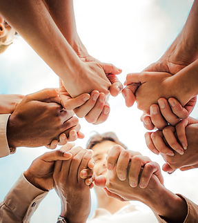 Multi ethnic group of young people holding hands outdoors - Community life style concept w