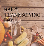Image of happy thanksgiving day text over autumn leaves and produce on wooden background T