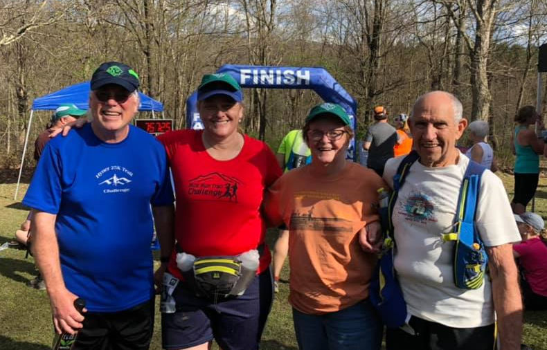 Donna Carnahan Wagner (red) with husband Russell alongside Carl and Carl's wife, Joyce at Hyner. 