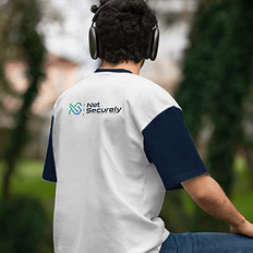 Team member wearing NetSecurely shirt walking outdoors – representing trusted cybersecurity professionals