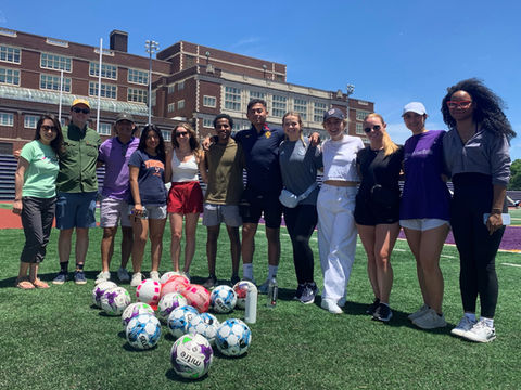 volunteers with soccer balls