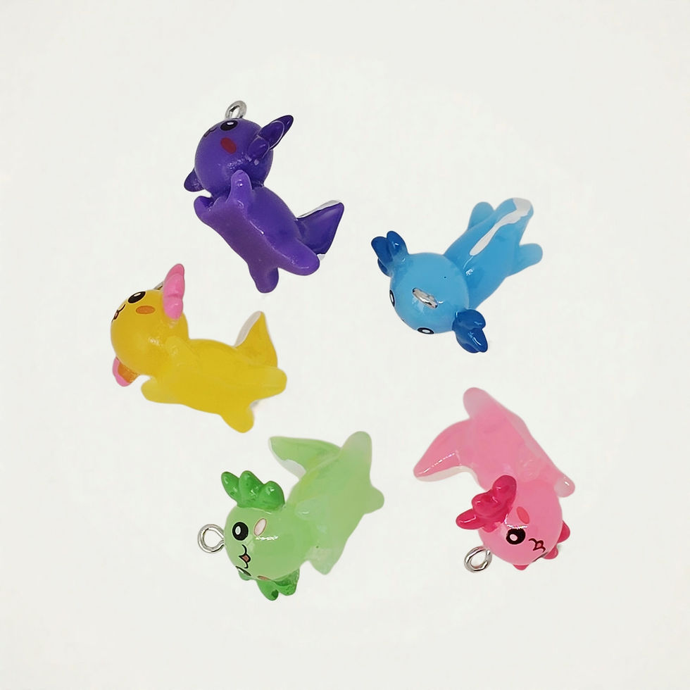 axolotl charm made of resin on plain background