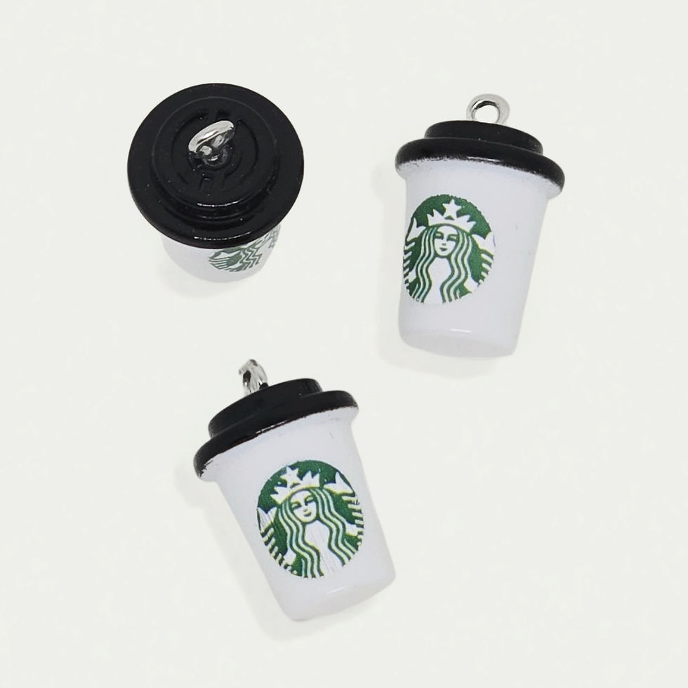 logo style coffee cup charm made of resin on plain background