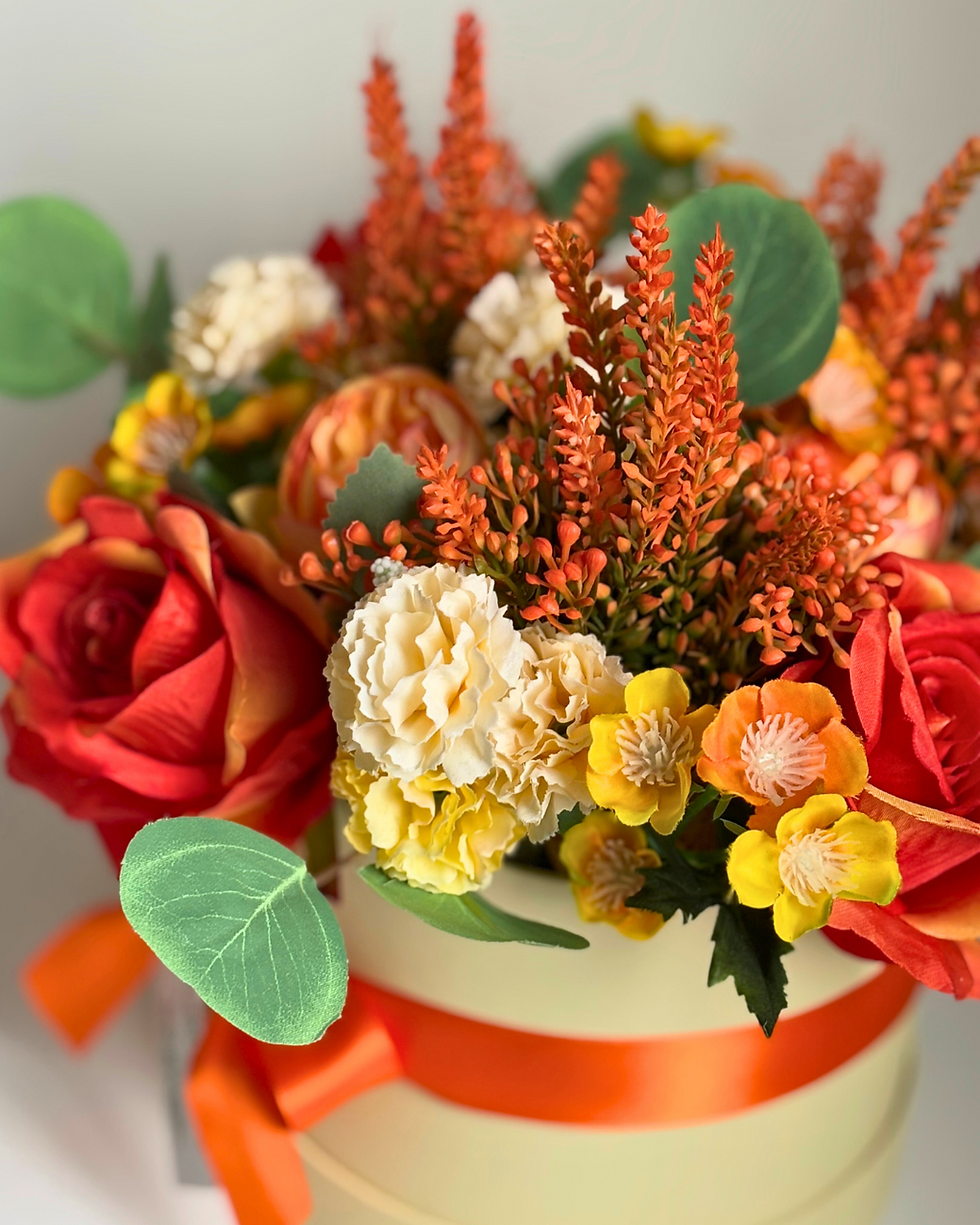 Orange hat box flower bouquet close up of flowers