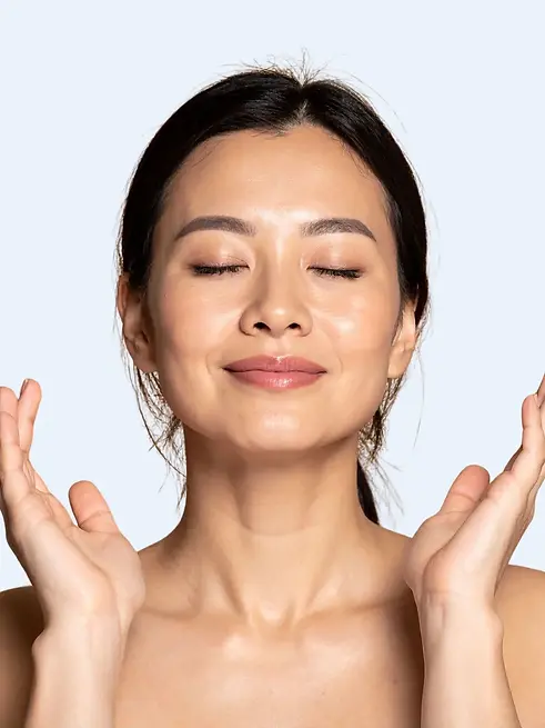 Patient with radiant, hydrated skin after Korean Glass Skin Rejuvenation treatment at Full Spectrum Face + Body in Tacoma.