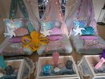 Whimsical undersea-themed sleepover setup with colorful decorations.