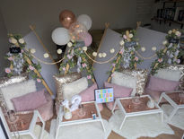 Cosy indoor setup with balloons and decorative tents.