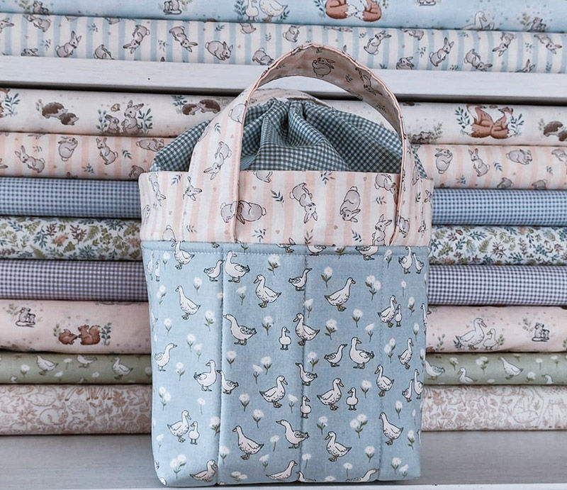 fabric drawstring bag in blue and pink shades