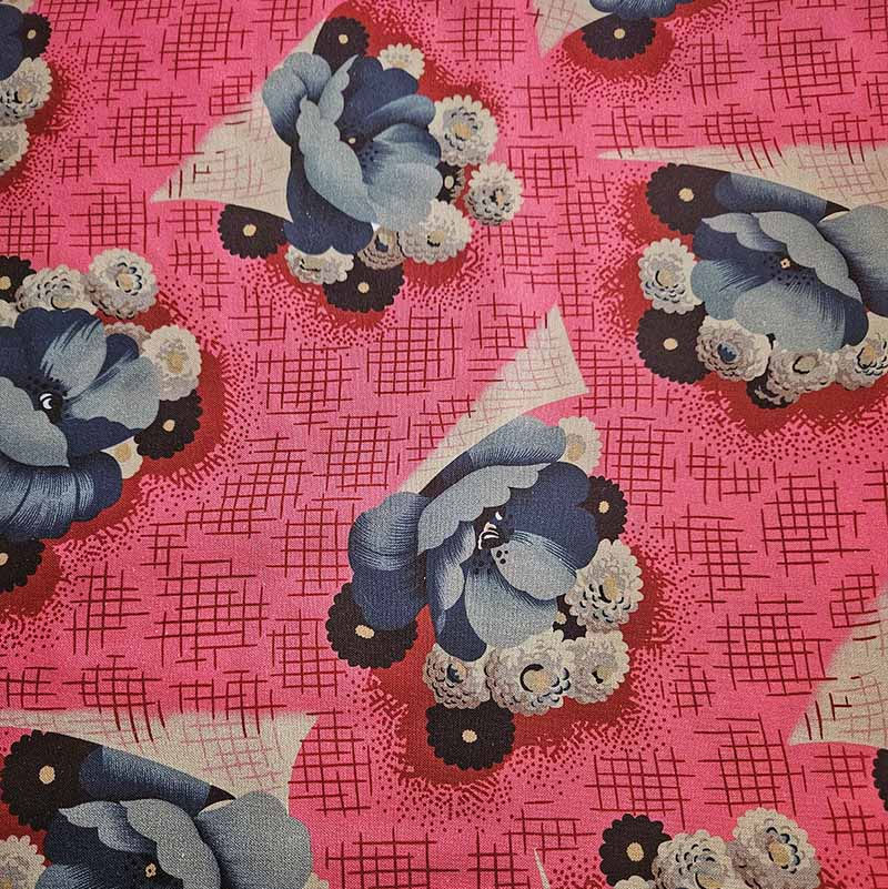 pink fabric with blue floral design