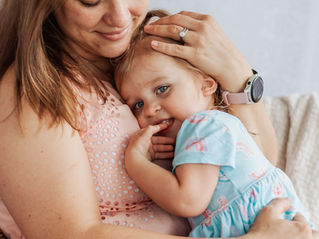 a mom and her toddler snuggle together at a mommy and me mini session in Pittsburgh