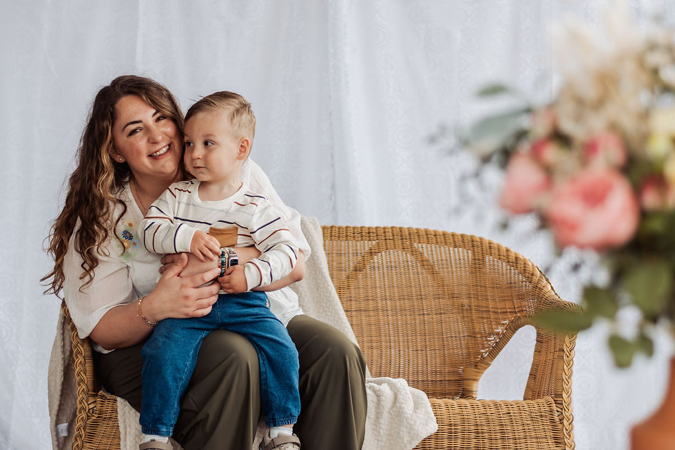 a mom smiles with her son at a mother's day mini session photoshoot in the south hills of pittsburgh