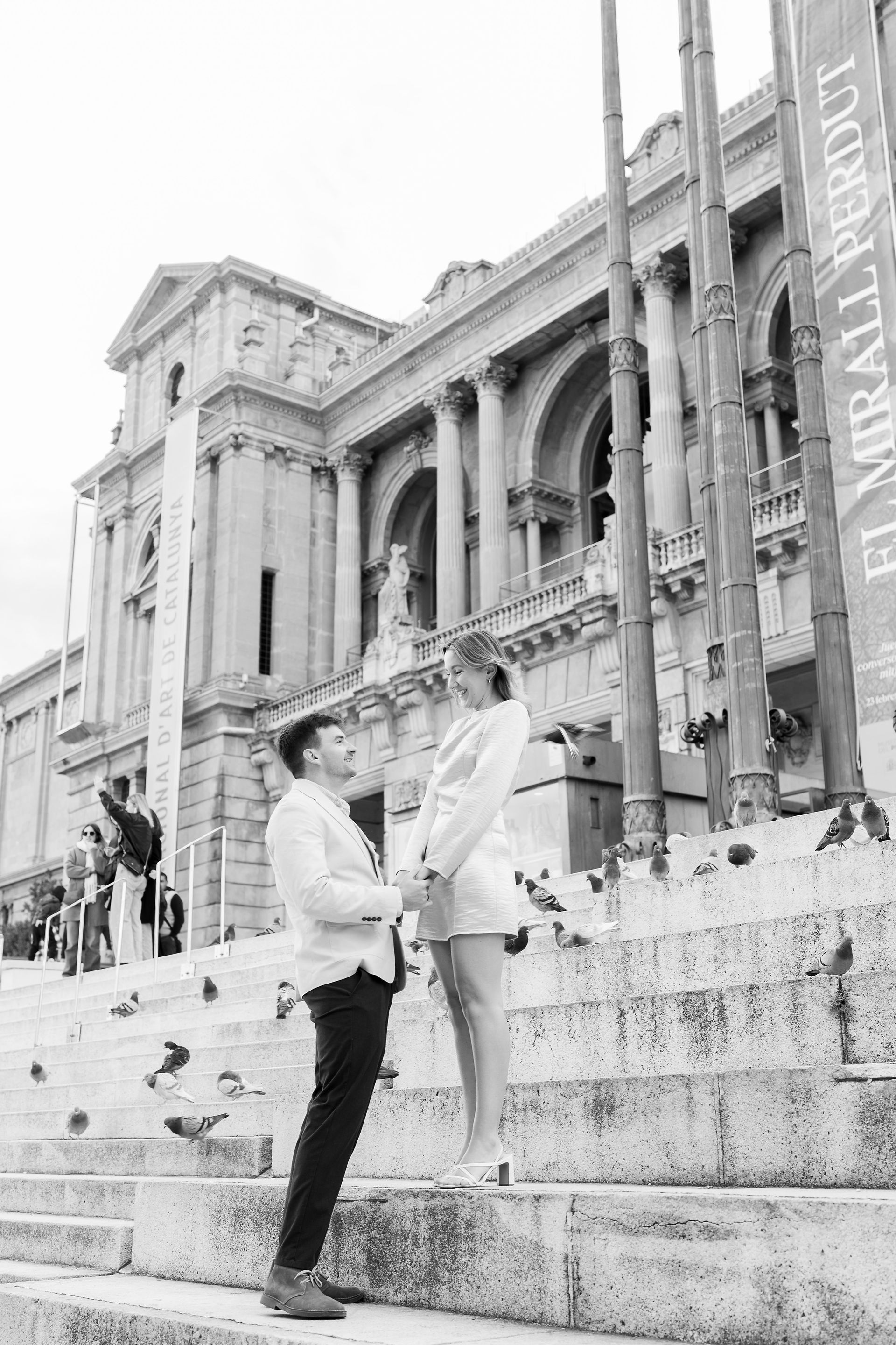 A couple standing in Plaza España for a romantic photograph