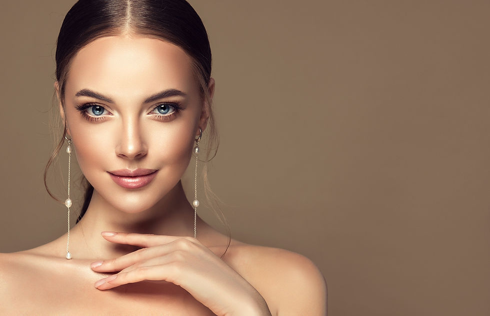Beautiful girl . Fashionable and stylish woman in trendy jewelry big earrings . Fashion l