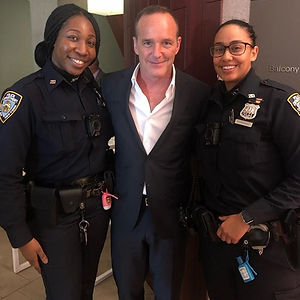 Clark Gregg with police officers