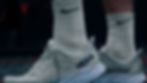 Close up on feet wearing Hoka rocker sole running shoes