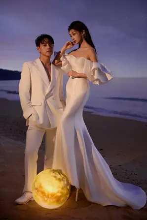 Couple poses for their beach concept pre wedding photoshoot portrait.