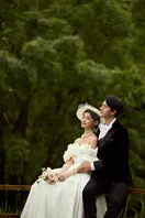 Bride and groom in vintage-inspired wedding attire.
